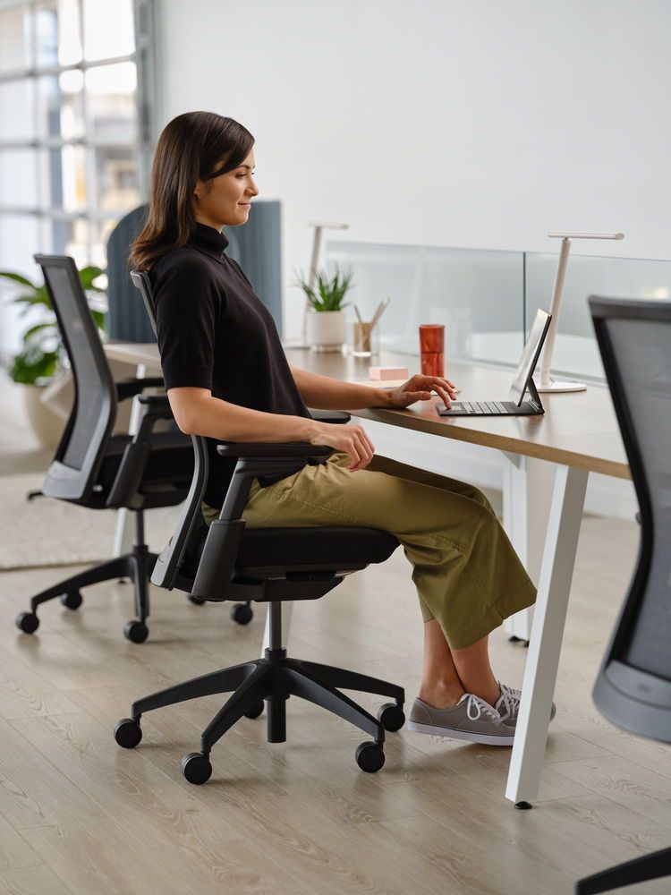 Diagram showing an ergonomic workspace review layout with desk and equipment zones